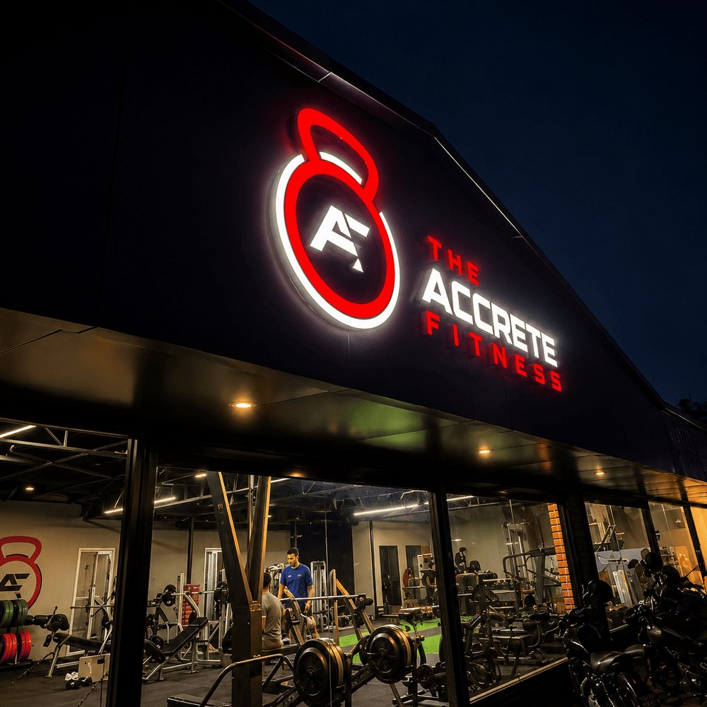 Accrete Fitness storefront entrance at night